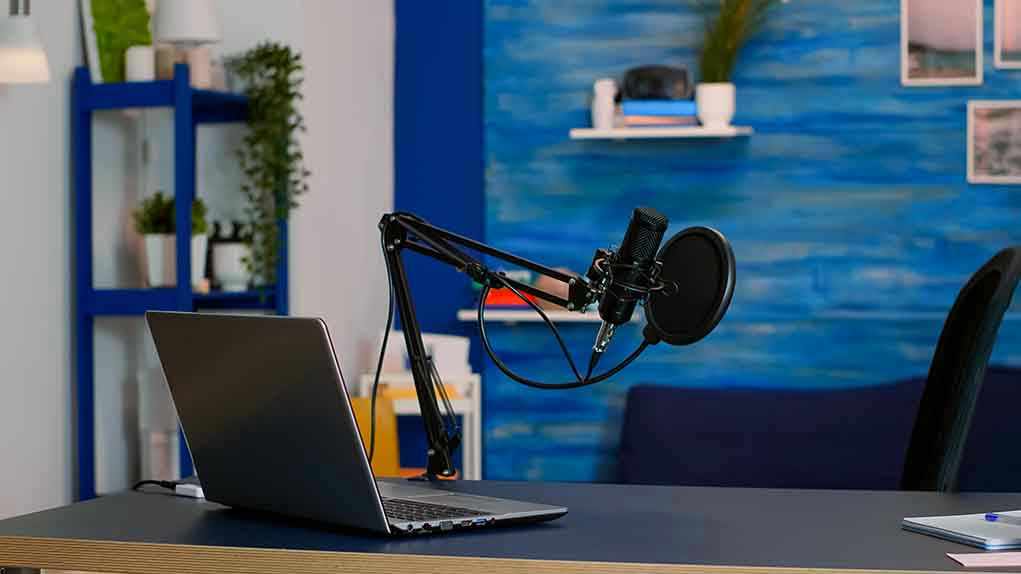 Laptop and a microphone on a desk