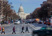 Congress Standoff ERUPTS—Hawley Turns Up Heat People crossing street near the US Capitol building