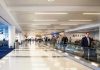 Pro-Hamas CYBERATTACK Terrorizes Airports People walking through a busy airport terminal