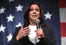 Democratic Civil War BREWING Over Harris Future Woman speaking with microphone American flag background