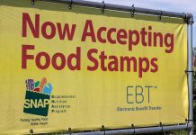 Fears Amplify, But Refugees Take SNAP Hit Yellow sign now accepting food stamps EBT SNAP
