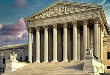 Building with columns and statues in front of entrance