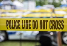 SHOCKING 911 Call — Mother Kills Child Yellow police line tape with Do Not Cross.