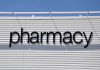 Sign displaying the word pharmacy against a white background