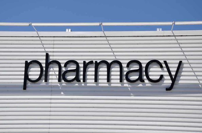 Sign displaying the word pharmacy against a white background