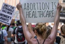 Pro-Lifers Arrested as Abortion Pill Battle Heats Up in D.C. Protestors holding signs about womens rights and healthcare.