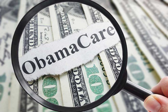 Magnifying glass over Obamacare text and money