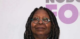 Epstein Files Frenzy Targets Whoopi Goldberg Person with dreadlocks and round glasses, smiling slightly.