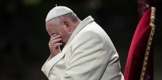American Pope Defies Trump: Faith vs. Politics Pope sitting with his head bowed and hand covering his face