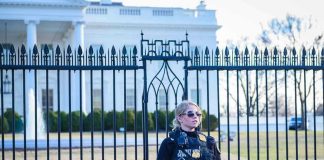 Gunfire Erupts at White House – Chaos Unleashed! Secret Service agent stands guard outside the White House.