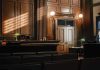 Supreme Court BOMBSHELL: Murdaugh Convictions Vanished! Empty courtroom with judges bench and wooden decor.