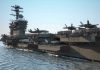 SHOCKING Strikes: U.S. Takes Action Amid Peace Talks Aircraft carrier deck with jet planes.