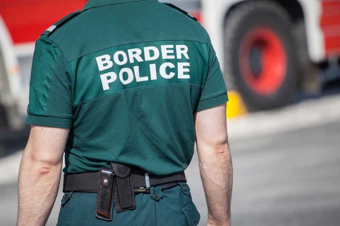 Person in Border Police uniform standing outdoors.