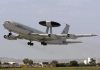 U.S. Bombers Cut: NATO Unnerved NATO AWACS aircraft taking off from an airfield