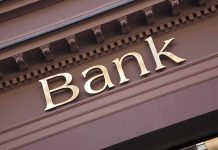 Trump’s Banking Order STUNS—Citizenship Now Key Close-up of a bank sign with gold lettering