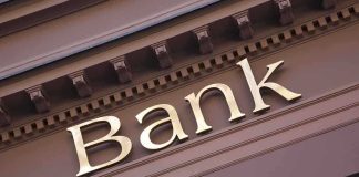 Trump’s Banking Order STUNS—Citizenship Now Key Close-up of a bank sign with gold lettering