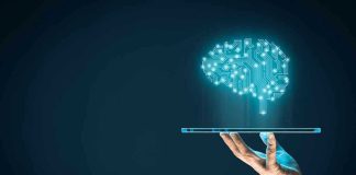 Government Buys Into AI? Buckle Up Hand holding tablet projecting digital brain hologram.