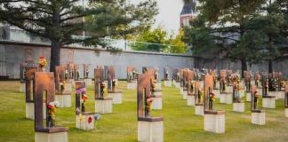 A Grave Desecration Claim Went Viral—But The Evidence Is Surprisingly Thin A memorial site with numerous sculptures and flowers in a grassy area