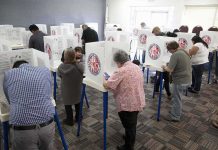 Election Blue Line Crossed In California? Voters fill out ballots at polling booths in a busy voting room