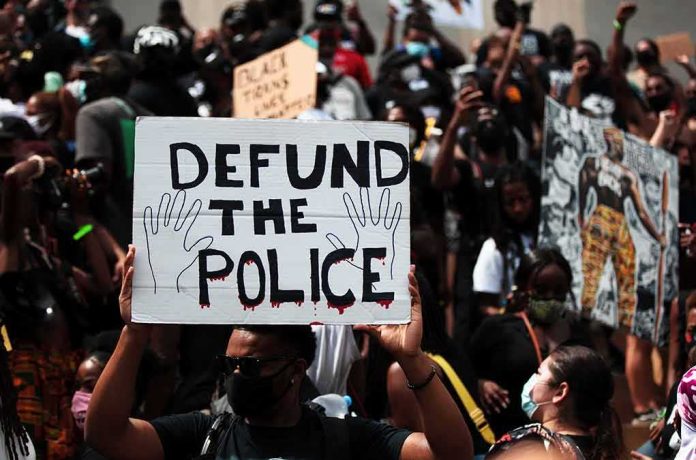 Protester holding a sign at a crowded demonstration