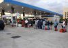 America’s Fuel Cushion Evaporates Fast People waiting in line at a gas station with fuel containers