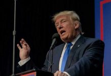 Ballot Crackdown BACKFIRES — Troops Caught In Middle Person speaking into microphone at a podium.