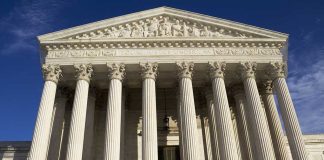 Shock Release, Verdict Survives Facade of the Supreme Court building featuring tall columns and intricate carvings