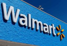Budget Squeeze Exposed At Walmart Walmart storefront sign on bright blue exterior wall