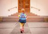 Forensic Trail Points Somewhere—Not Where Expected child with backpack walking toward school steps