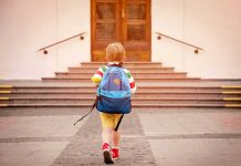 Forensic Trail Points Somewhere—Not Where Expected child with backpack walking toward school steps