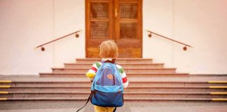 Forensic Trail Points Somewhere—Not Where Expected child with backpack walking toward school steps