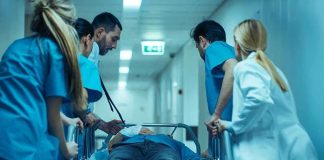 U.S. Demands Release After Eerie Hospital Turn Medical team rushing patient on a gurney through hospital corridor