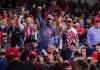 Election Interference Escalates — Again Crowd of supporters cheering at an indoor political rally