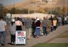 28,000-Ballot Blunder Shakes Wisconsin voters standing in a long line outside a polling place
