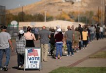 28,000-Ballot Blunder Shakes Wisconsin voters standing in a long line outside a polling place