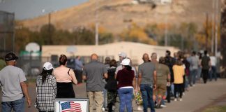 28,000-Ballot Blunder Shakes Wisconsin voters standing in a long line outside a polling place