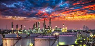 Deep Strikes Hammer Russia’s Oil Heart Oil refinery with storage tanks at sunset