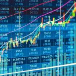 Stock market chart with rising candlesticks and trend lines