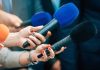 Gas Leak Chaos After Malibu Cave-In Reporters holding colorful microphones