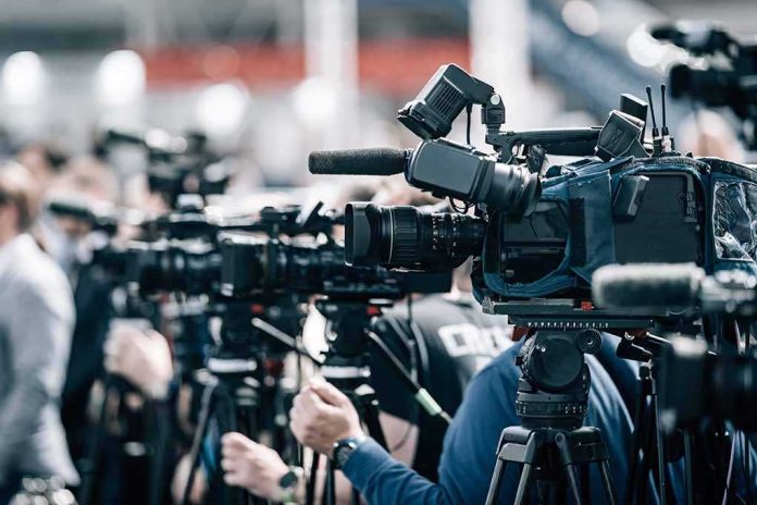 default-hero-02 Broadcast cameras on tripods at a press event