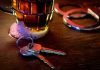 Seized Beer Leads to a High Stakes Permit Fight House keys on bar beside beer mug and handcuffs