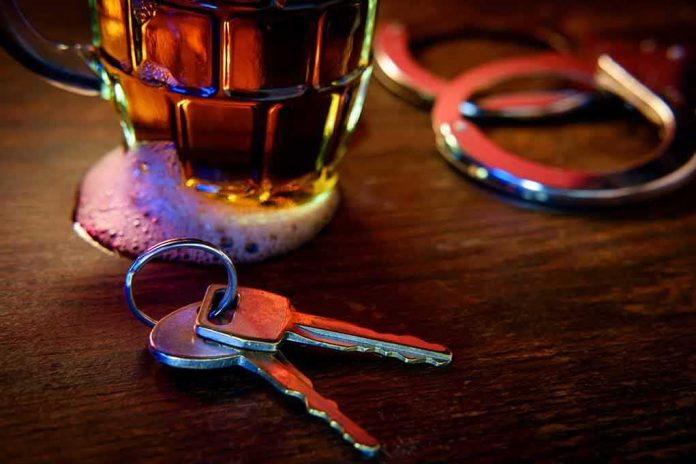 House keys on bar beside beer mug and handcuffs