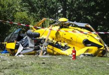On-Air Disaster Over LA – Investigation Looms yellow helicopter crash scene on grassy field
