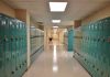 Disturbing Discovery Triggers Coach Arrest School hallway with rows of teal lockers