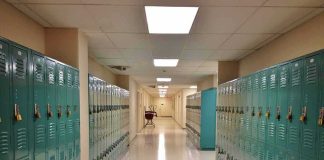 School hallway with rows of teal lockers