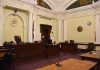 empty courtroom with judge's bench and columns