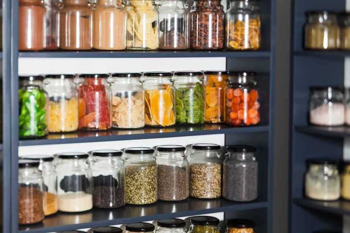 shutterstock_1447823609 Glass jars filled with dried foods on pantry shelves