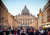 Paris Sees One Of Its Largest Religious Gatherings St. Peter's Basilica viewed from a busy street with crowds