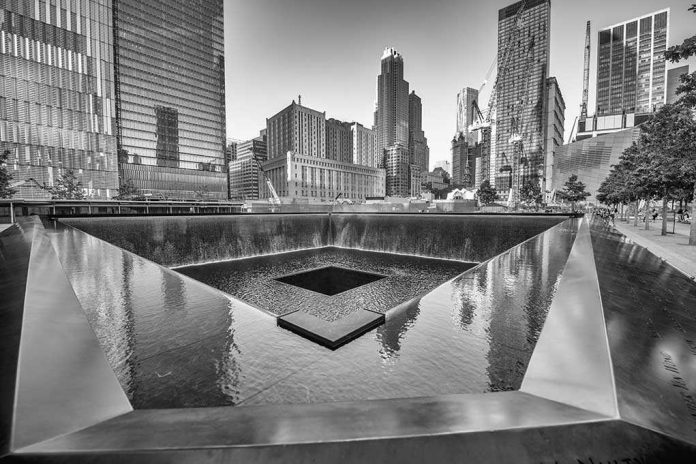 shutterstock_178009988 A memorial water feature surrounded by tall buildings in a city