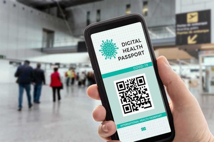 Smartphone displaying a digital health passport QR code at an airport